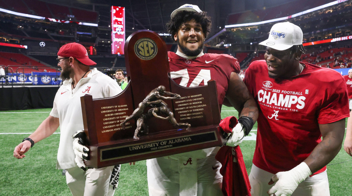 Alabama offensive lineman Kadyn Proctor celebrates the SEC championship.