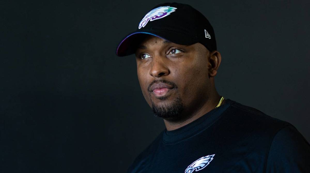 Eagles offensive coordinator Brian Johnson looks on before a game.