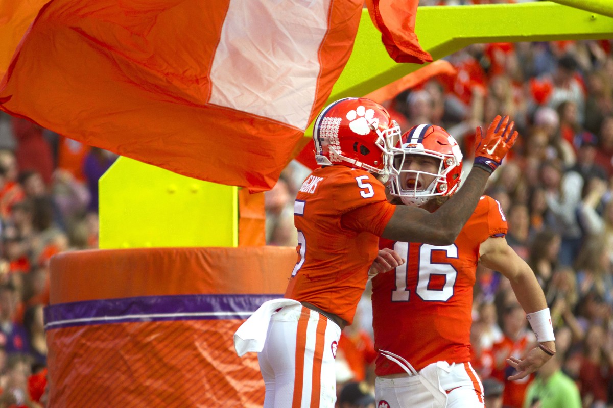 Nov 16, 2019; Clemson, SC, USA; Clemson Tigers wide receiver Tee Higgins (5) celebrates with quarterback Trevor Lawrence (16) after scoring a touchdown during the first half of the game against the Wake Forest Demon Deacons at Clemson Memorial Stadium. Mandatory Credit: Joshua S. Kelly-USA TODAY Sports