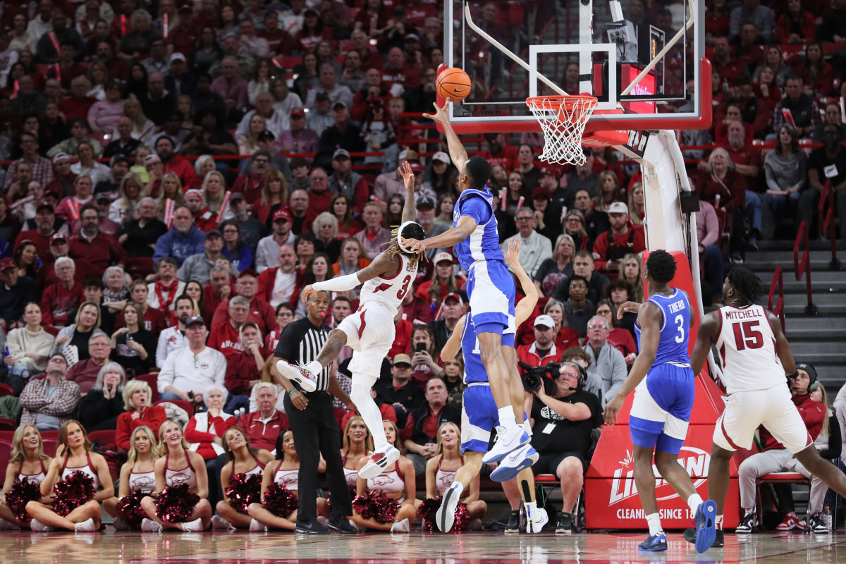 Jan 27, 2024; Fayetteville, Arkansas, USA; Kentucky Wildcats forward Ugonna Onyenso (33) blocks a shot by Arkansas Razorbacks guard El Ellis (3) during the first half at Bud Walton Arena. Mandatory Credit: Nelson Chenault-USA TODAY Sport