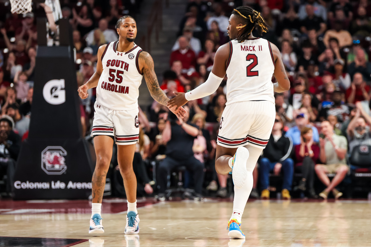 Ta'Lon Cooper and forward B.J. Mack celebrate a basket against the Missouri Tigers