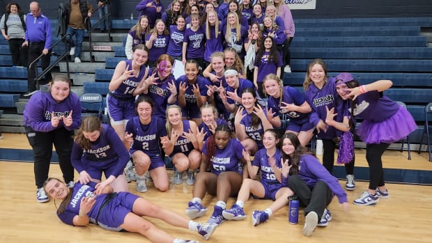 Jackson players celebrate after defeating Anthony Wayne in the OHSAA Division I regional semifinals on March 6, 2024.