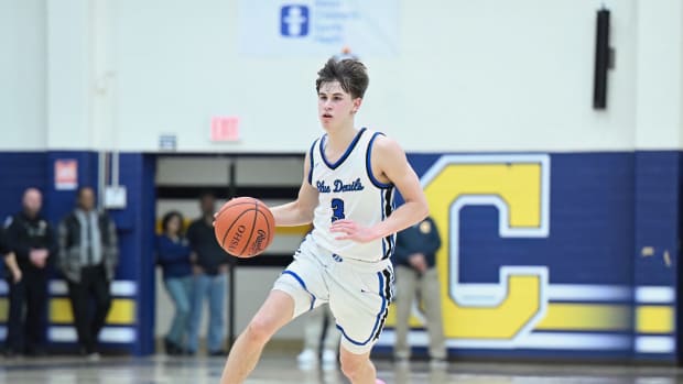 Brunswick's Quinn Barnett dribbles up the floor in a district semifinal game against Akron Garfield on March 6, 2024.