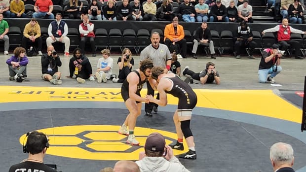 Aidan Fockler of Massillon Perry (left) and Antonio Bottiggi of Painesville Riverside (right) battle in the 285-pound OHSAA state championship match on March 10, 2024.