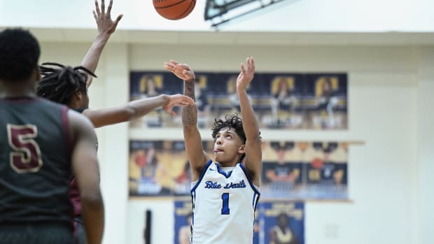 Quinn Barnett of Brunswick takes a jump shot against Akron Garfield during a district semifinal on March 6, 2024.