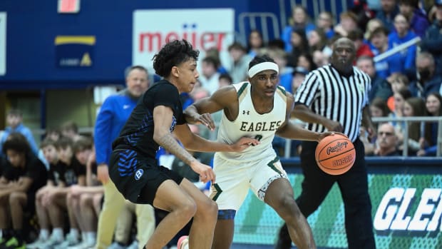 Brunswick's Quinn Barnett defends Ja'Corey Lipkins of GlenOak in a regional semifinal game on March 12,2024. Brunswick won 53-46 and Barnett held Lipkins to 10 points under his average.