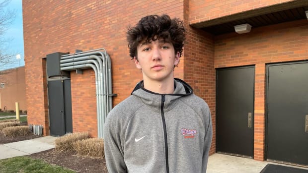 Olentangy Orange's Keegan Knupp poses for a phot after Orange defeated Newark in a regional semifinal on March 13, 2024