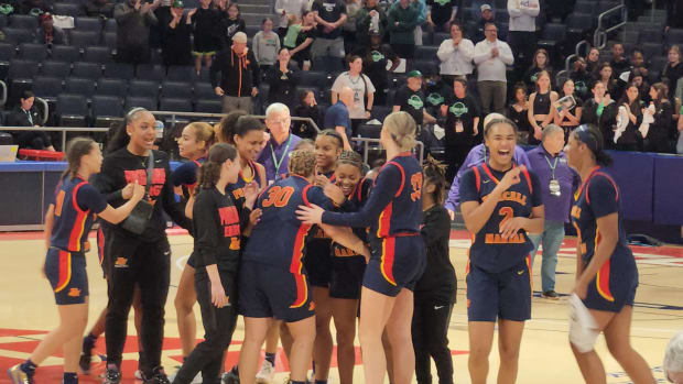 Purcell Marian players celebrate winning the 2024 Division II state championship.