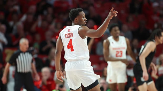 Houston Cougars guard LJ Cryer (4) reacts after a play during the first half against the Rice Owls at Fertitta Center. 