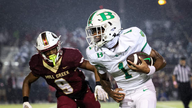 Buford's KJ Bolden runs with a catch as Mill Creek's Kaymon Bolden pursues. 11/13/2023