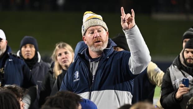 Archbishop Hoban head coach Tim Tyrrell talks to his team after defeating Massillon in the state semifinals at the University of Akron's InfoCision Stadium on November 25, 2022. Photo credit: Jeff Harwell