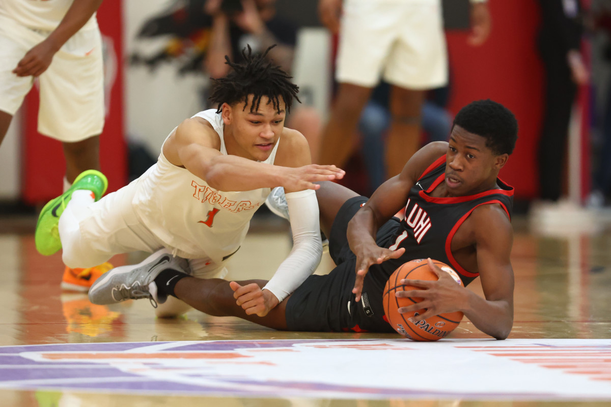 Dec 10, 2022; Scottsdale, AZ, USA; Wasatch Academy guard Isiah Harwell (left) dives for a loose ball against Long Island Lutheran guard VJ Edgecombe during the HoopHall West basketball tournament at Chaparral High School. Mandatory Credit: Mark J. Rebilas-USA TODAY Sports