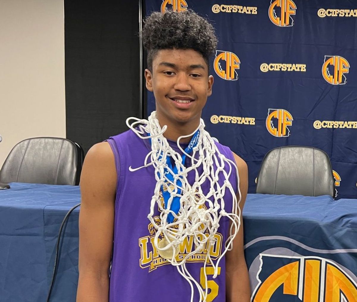 Jason Crowe celebrates a state title with a net draped around his neck. He swished many a night during a historic freshman season. 