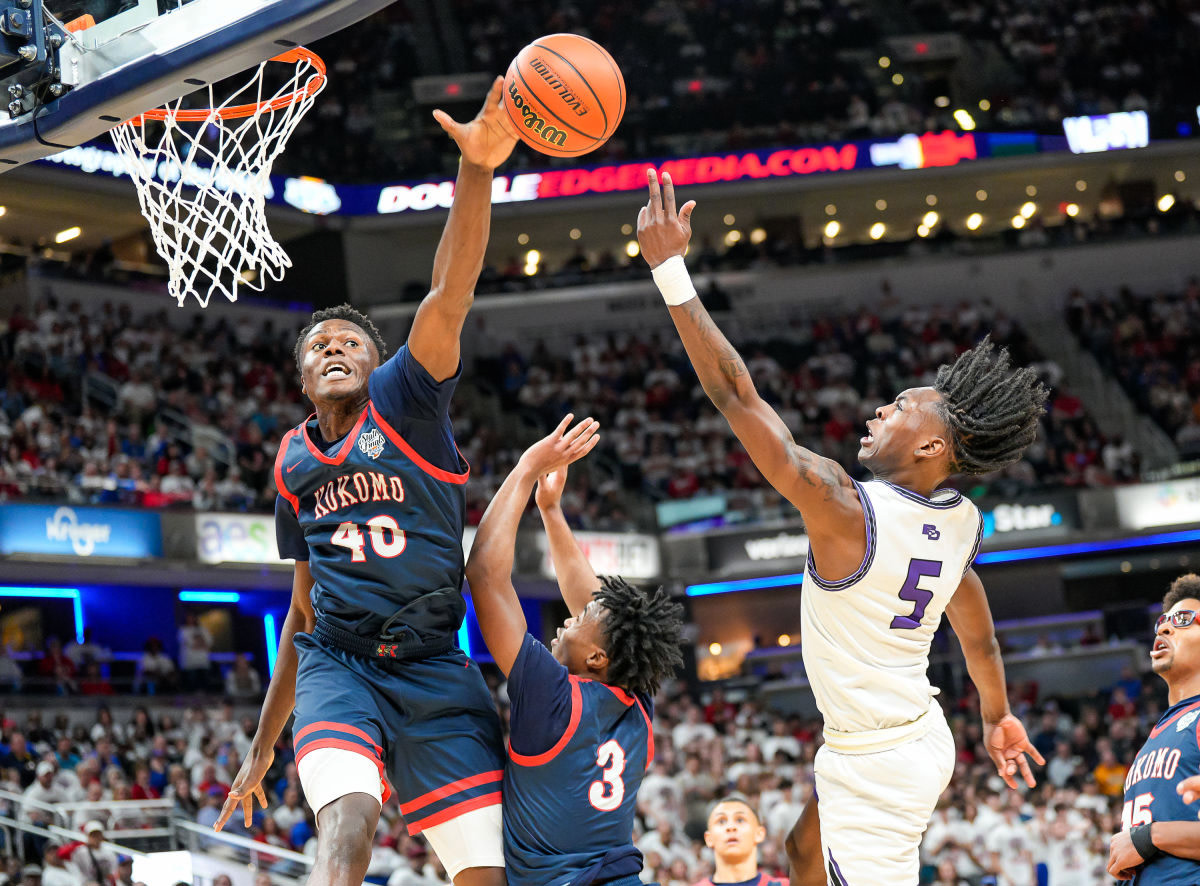 Flory Bidunga, Kansas commit and the nation's top-rated center, swats away a shot in the Indiana Class 3A state basketball tournament in 2022.