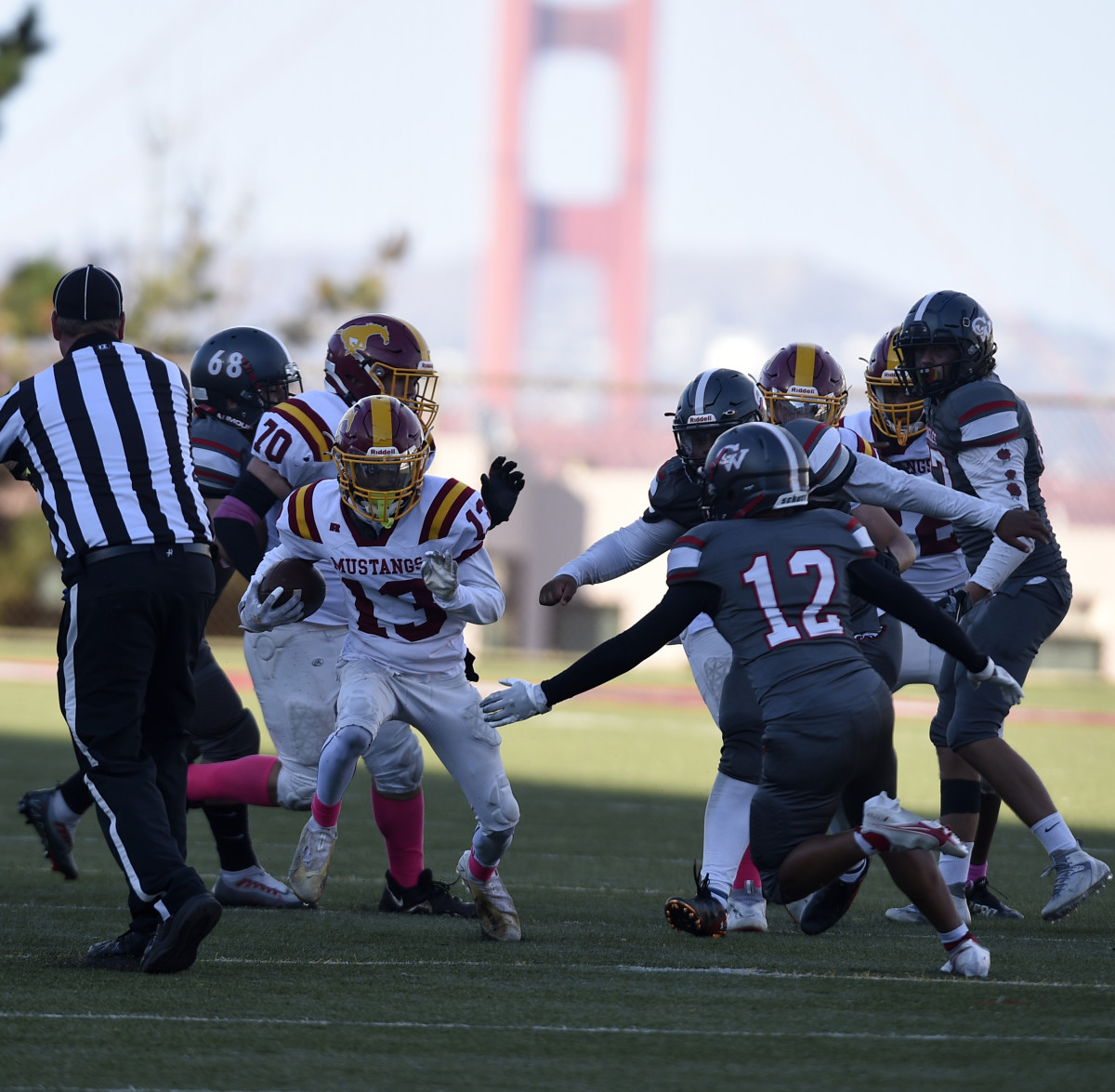 Renay Taylor (13), who scored the game's final touchdown, runs through a big hole. Photo: Eric Taylor