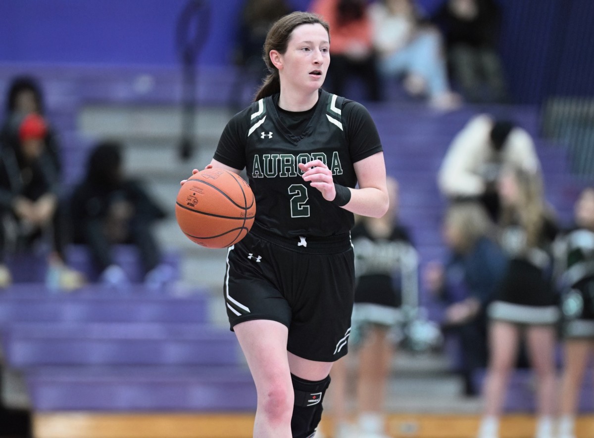 Aurora guard Sam Stask brings the ball up the floor in a game at Barberton on January 26, 2024.