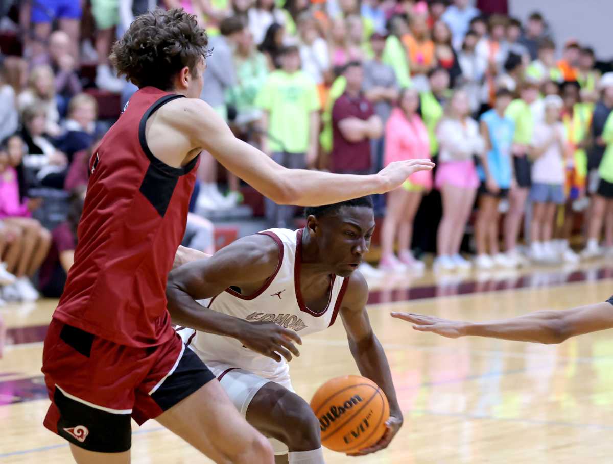 Edmond Memorial's Elijah Brown drives to the basket as Owasso's Jalen Montonati defends at Edmond Memorial High School on Jan. 30.