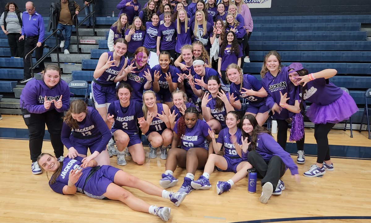 Jackson players celebrate after defeating Anthony Wayne in the OHSAA Division I regional semifinals on March 6, 2024.