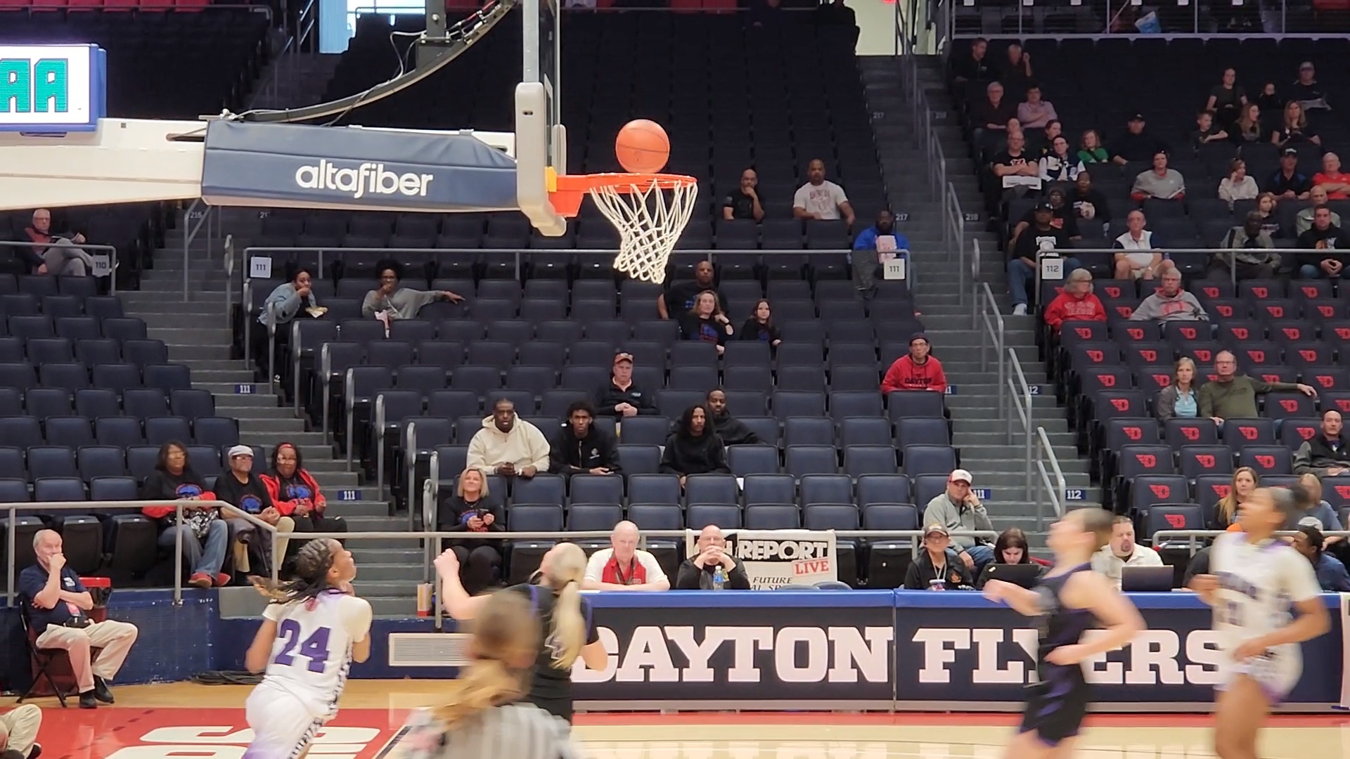 Africentric's Kamryn Grant (No. 24 in white) watches as her layup goes through the basket against Keystone in a Division IV state semifinal game on March 14, 2024.