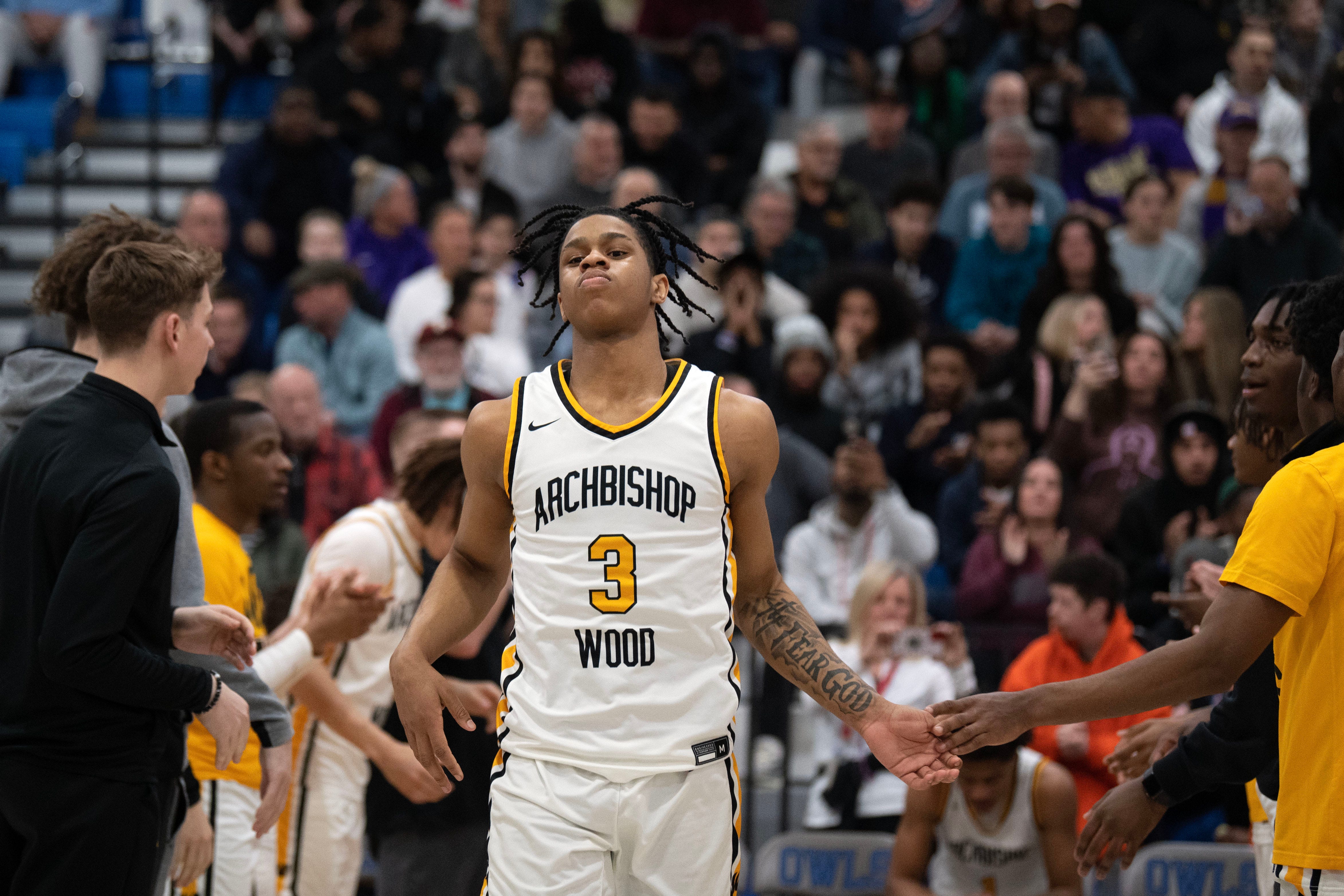 Archbishop Wood's Milan Dean enters the court after his name is called in the starting lineup before the PIAA semifinal game against Roman Catholic at Bensalem High School on Tuesday, March 21, 2023.