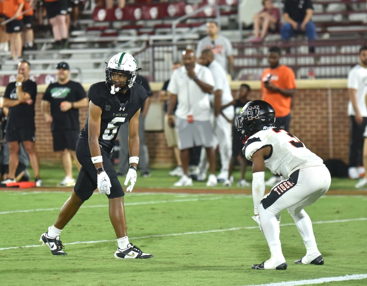 Norman North receiver Mason James (left) lines up against Norman in the two teams' "Crosstown Clash" on Aug. 31, 2023.