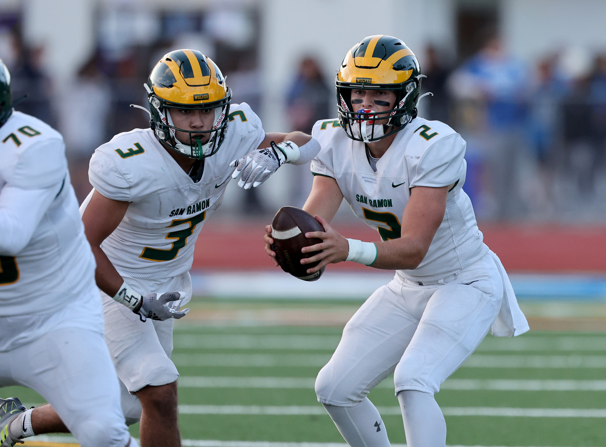 San Ramon Valley's Luke Baker (2) with play action fake to John Pau Mendoza (3)