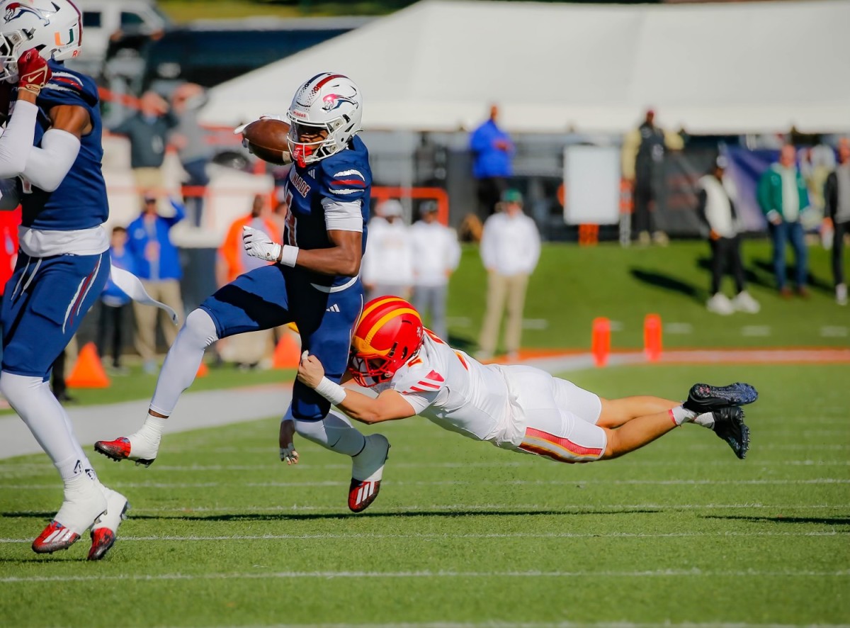 Chaminade-Madonna superstar wide receiver battles for yardage after a catch in the Florida 1M state championship game against Clearwater Central Catholic. 12/7/2023.