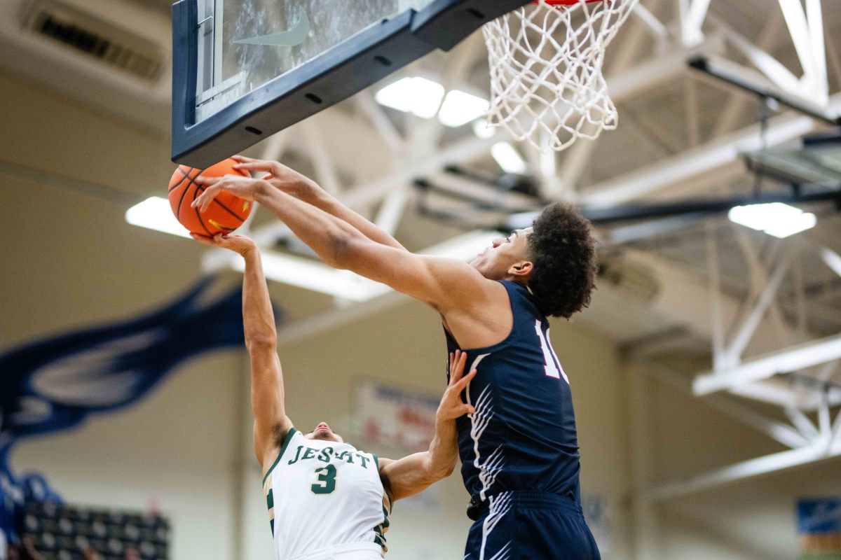 Koa Peat stuffs a Jesuit shot at the Les Schwab Invitational in December.