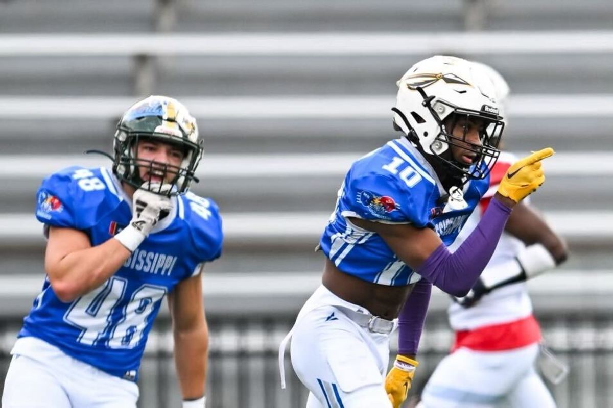 PJ Woodland (right) points in celebration after a big play in the Mississippi vs. Alabama all-star football game on Dec. 16.