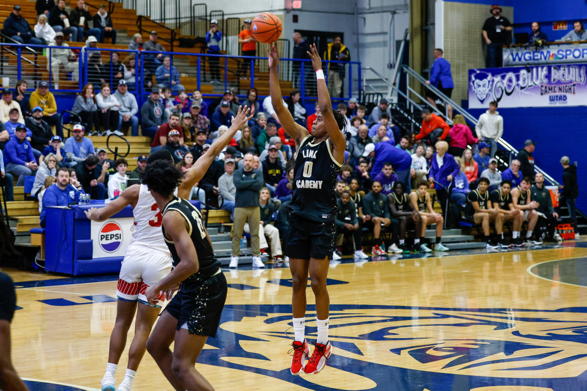 Link Academy's Tre Johnson rises high for a 3-pointer against Burlington School.