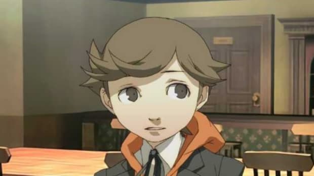 A popular Persona 3 mod removes Ken romance in FeMC route: An anime child with short brown hair is standing in a grungy room with brown wallpaper and darkly patterned carpet. He's wearing a black blazer with an orange hood and has a worried expression on his face