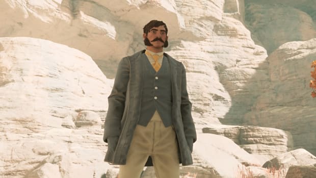 A Nightingale player wearing a ratty coat, vest, and trousers, standing in the shade near some sunbaked rocks