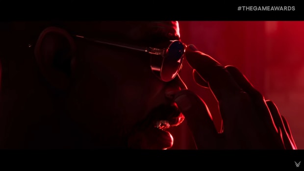 Blade putting on his sunglasses.