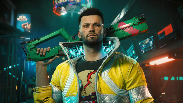 Cyberpunk 2077 Phantom Liberty is CDPR’s most expensive DLC: A man with short dark hair, a growth of stubble on his chin, and electric circuits running around his eyes stands in the middle of a dark street illuminated faintly by dim neon lights.