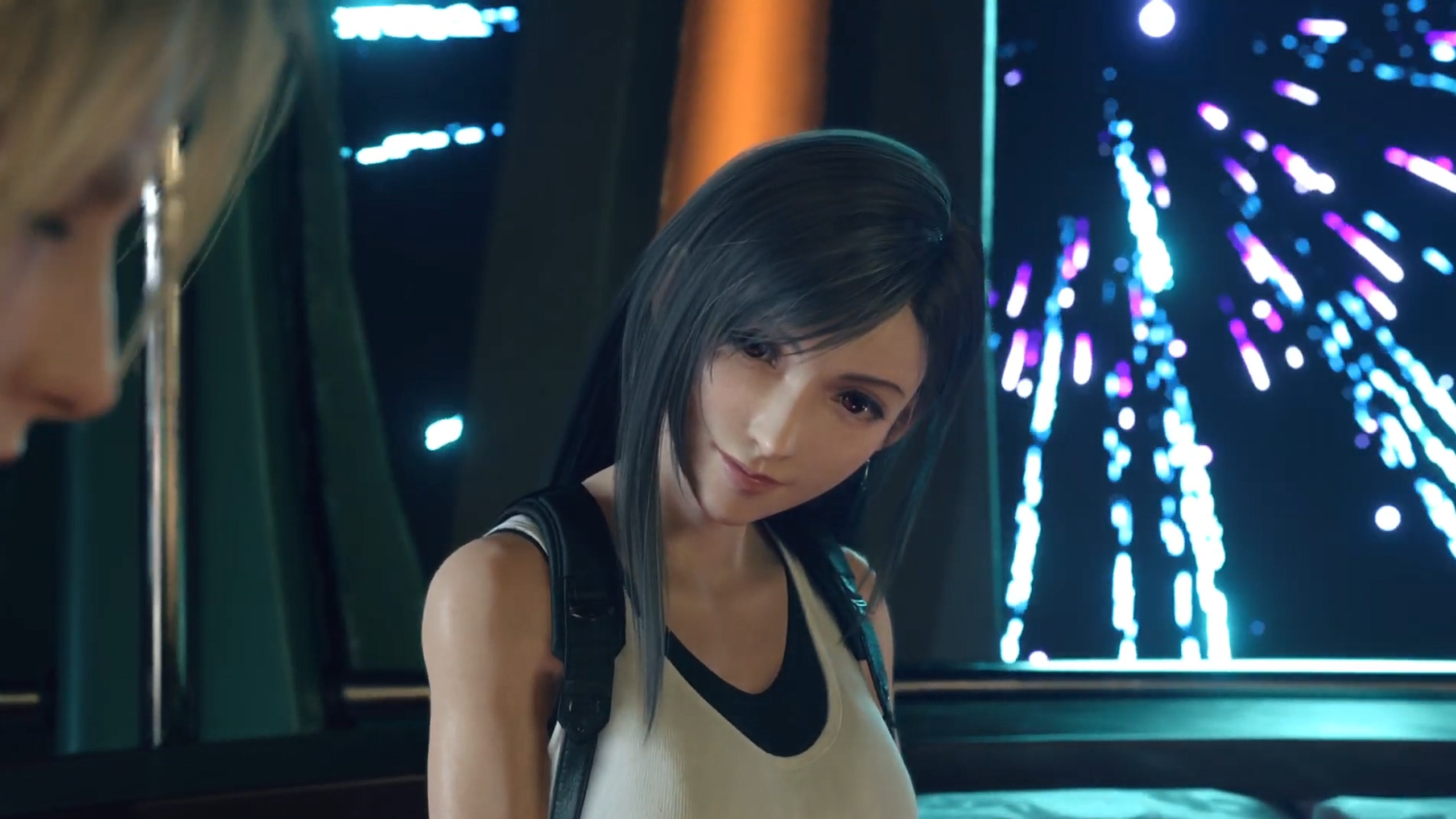 FF7 Rebirth's Tifa, sitting in the Gold Saucer's Ferris wheel as fireworks explode out the window behind her