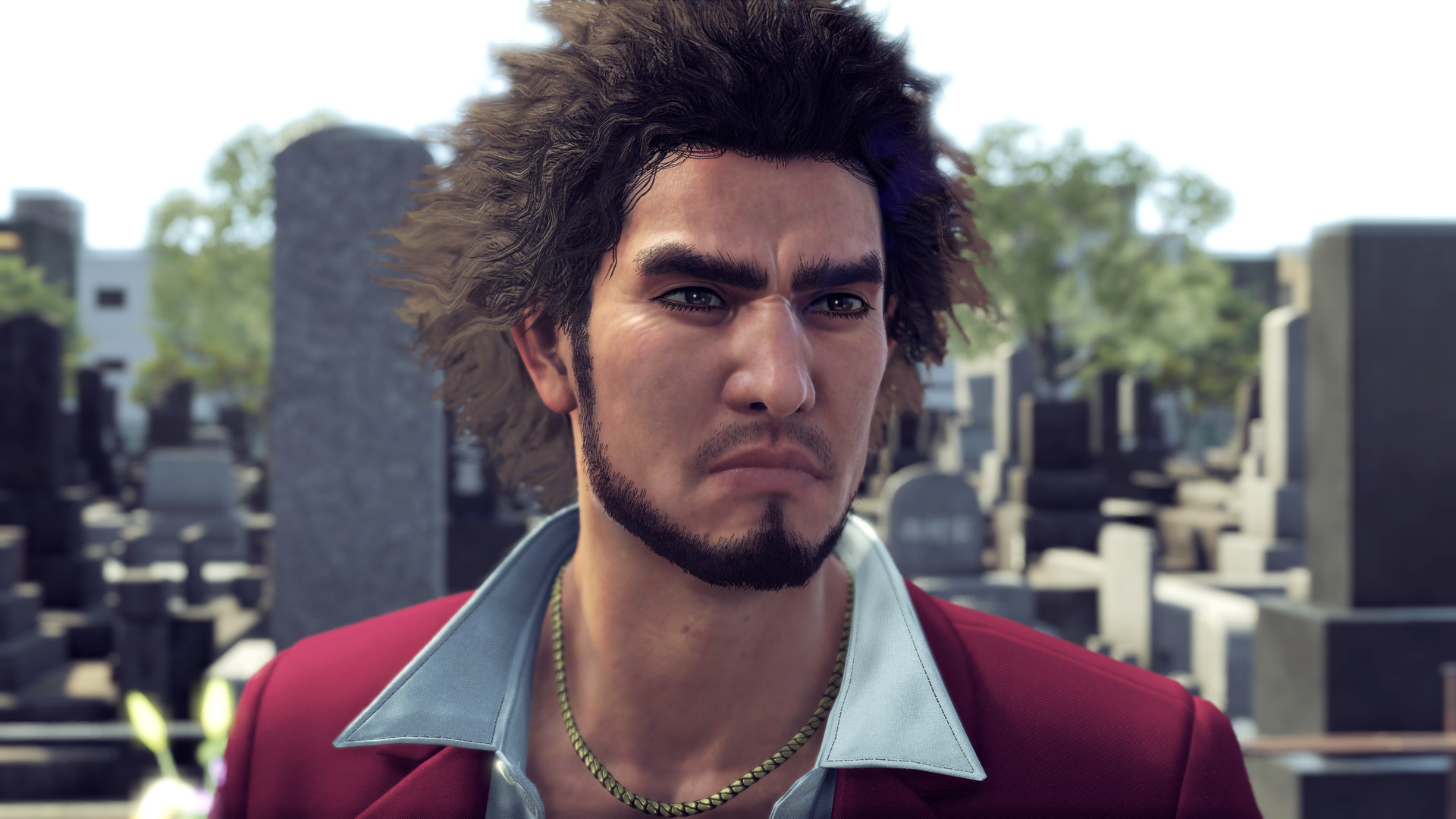 Yakuza's Ichiban, wearing a red suit and collared white shirt, looking around a graveyard